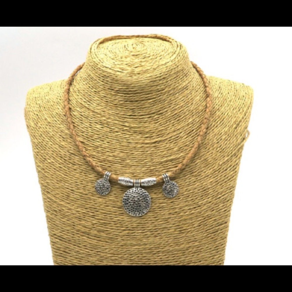Cork leather with silver medallions.